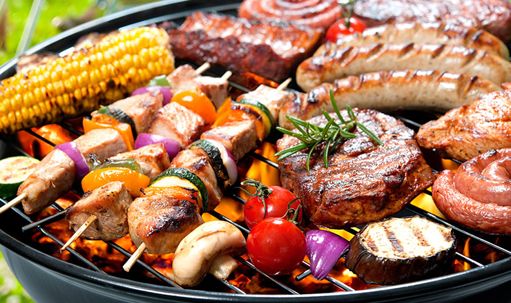 Assorted grilled meats and vegetables seasoned with smoked barbeque BBQ rub