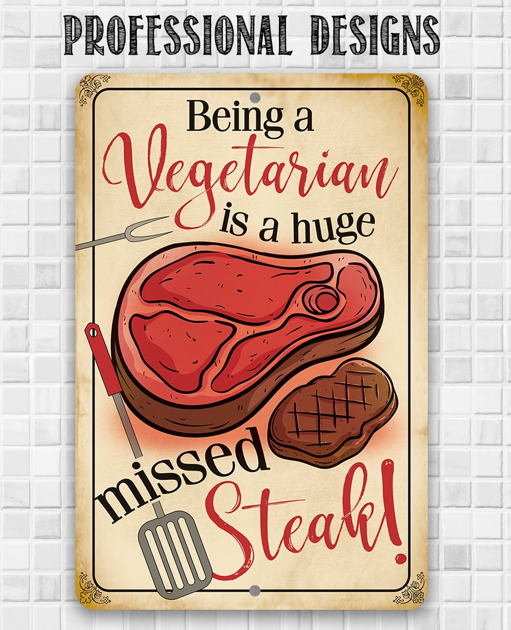 Metal sign reading “Being a Vegetarian is a huge missed Steak!” with steak artwork