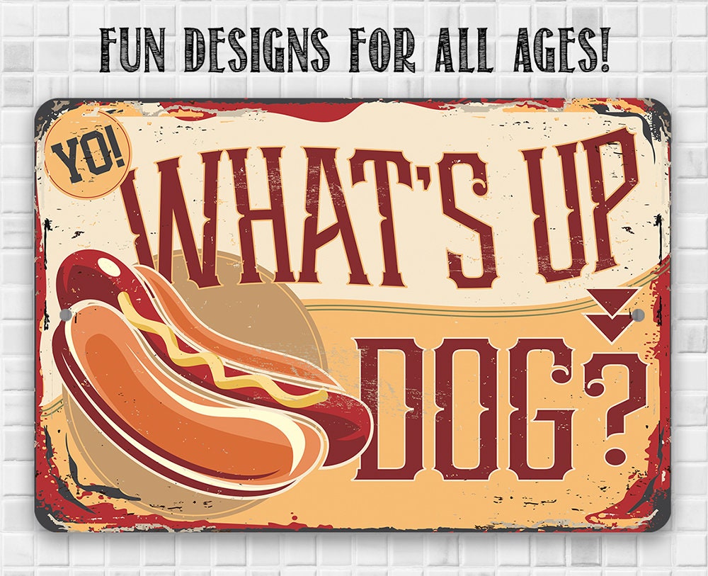 Rectangular metal dog meme sign with 'What's up, dog?' typography and hot-dog icon