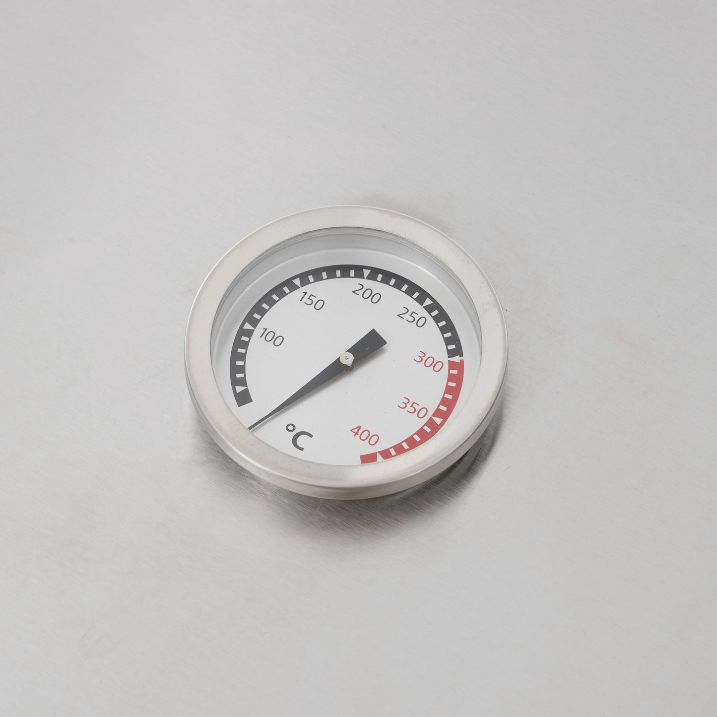 Round temperature gauge for gas grill with °C dial markings and red range