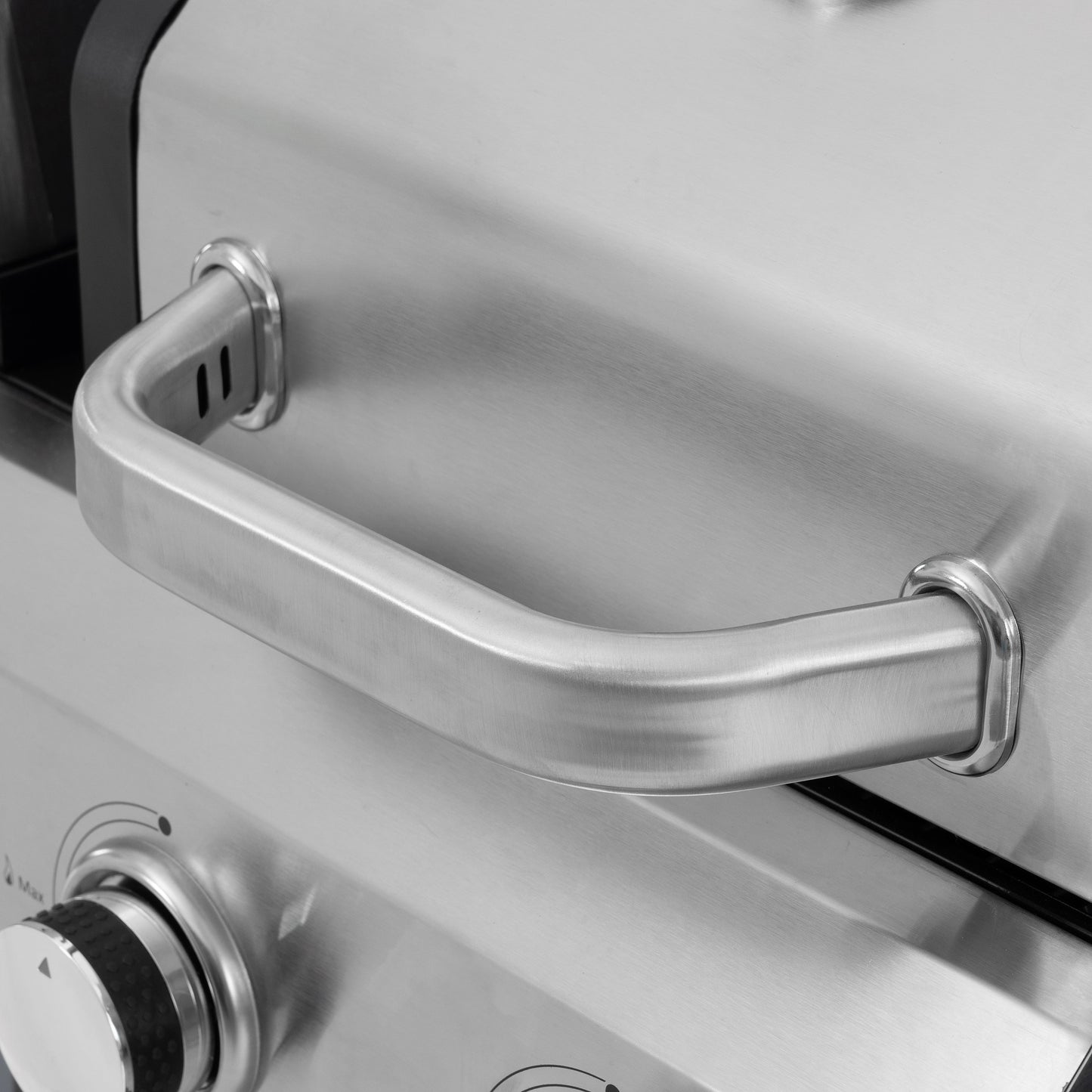 Silver lid with side handle on black and silver gas grill griddle unit