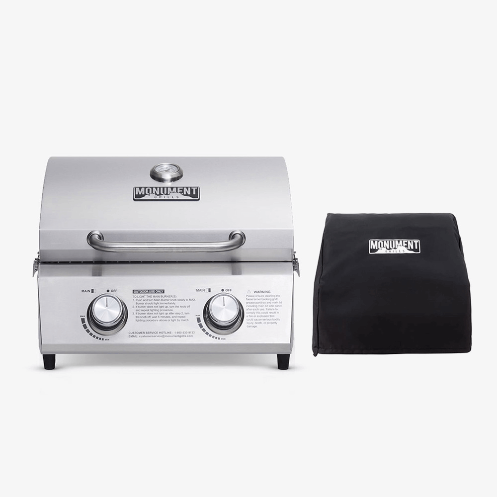 Stainless tabletop propane gas grill with black cover, two control knobs and handle