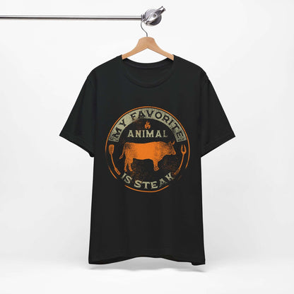 Black T-shirt on hanger with orange and tan round animal steak logo graphic