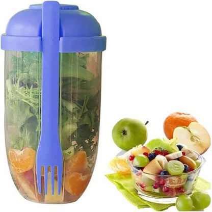 Purple salad shaker cup with dressing container and built-in fork, with salad inside.