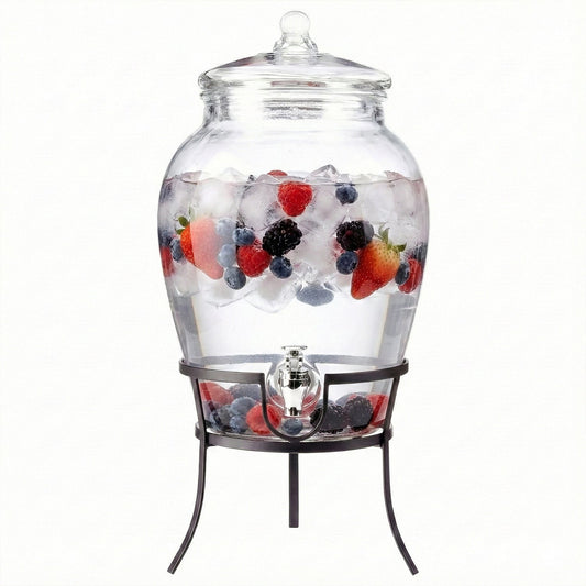 Glass beverage dispenser with clear lid and metal stand, filled with mixed fruit