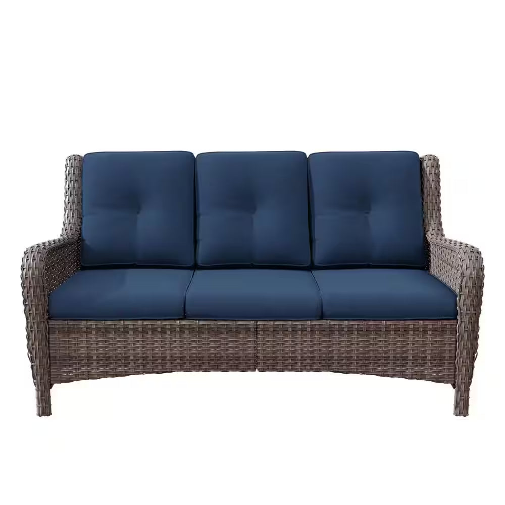 3-seat wicker sofa with dark blue tufted cushions and thick armrests