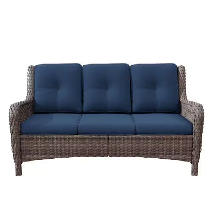 3-seat wicker sofa with dark blue tufted cushions and thick armrests
