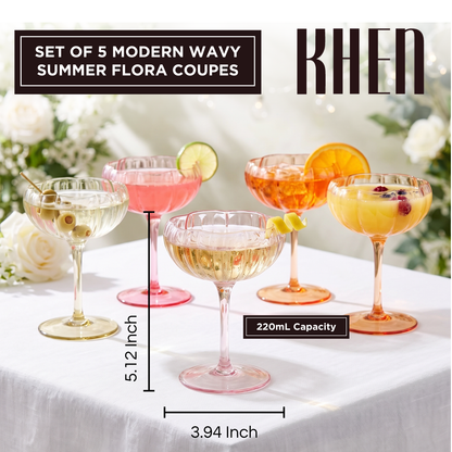 Set of 4 wavy flower coupe cocktail glasses in assorted pink, gold, and orange shades