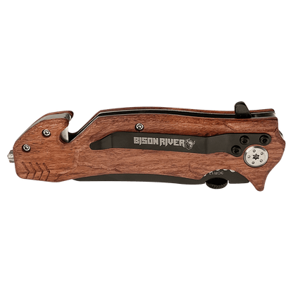 Rescue knife with wood-tone handle and black blade, angled side view