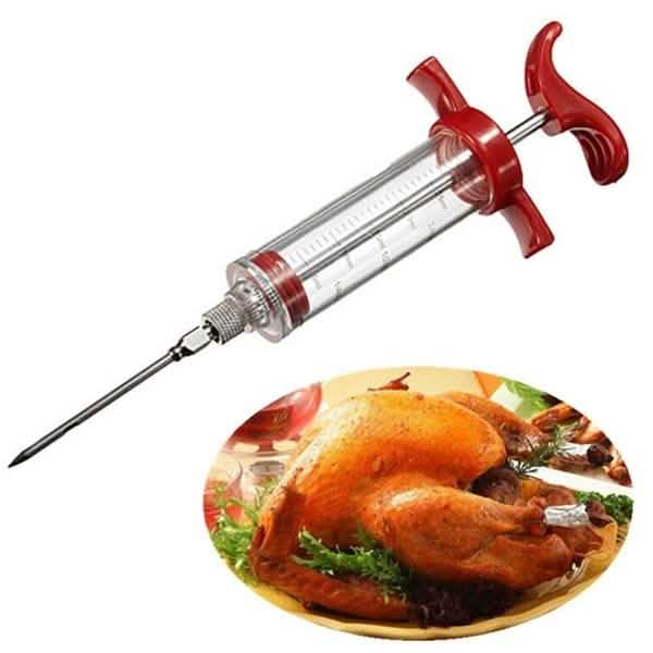 Marinade injector syringe with red side handles, clear barrel and needle tip