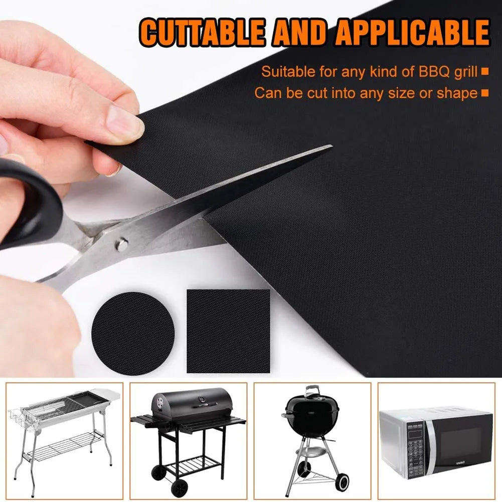 Cuttable black BBQ grill mat being trimmed with scissors, thin textured sheet