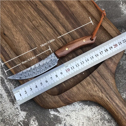 Meat scimitar knife length measurement with damascus-pattern blade and wooden handle beside ruler