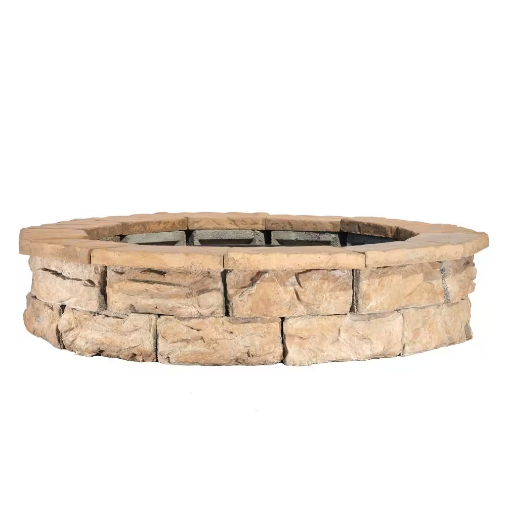 Round stone fire pit ring with dark inner fire bowl and metal grate insert