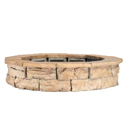 Round stone fire pit ring with dark inner fire bowl and metal grate insert