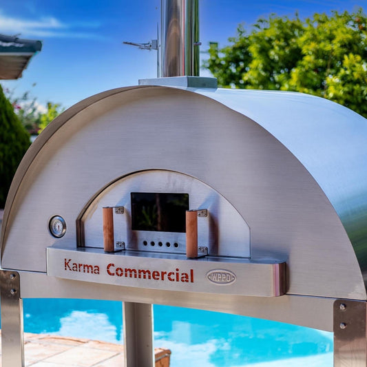 Stainless steel commercial wood-fired oven with arched front and control panel