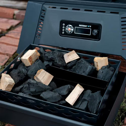 Digital charcoal smoker firebox filled with charcoal and wood chunks
