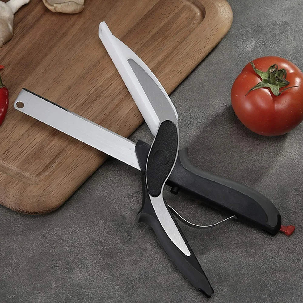 Kitchen scissors with built-in cutting board, silver blade, black grips, red end accents