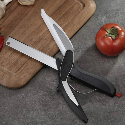 Kitchen scissors with built-in cutting board, silver blade, black grips, red end accents