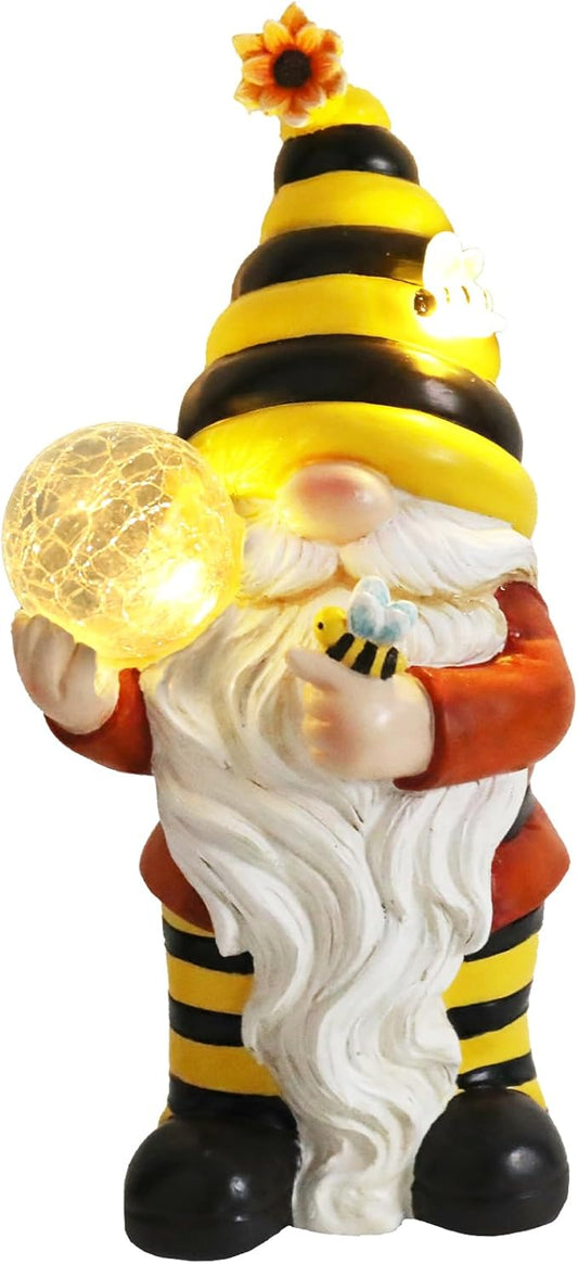Resin bee gnome statue with glowing crackle glass globe, wearing yellow striped hat