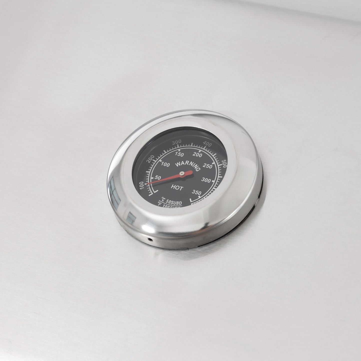 Round stainless grill temperature gauge with dial and red needle
