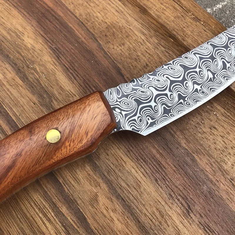 Damascus-pattern meat scimitar knife with wooden handle and brass rivet close-up