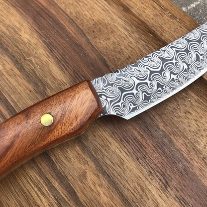 Damascus-pattern meat scimitar knife with wooden handle and brass rivet close-up