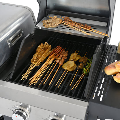 Open gas grill with cooking grates holding skewers and vegetables
