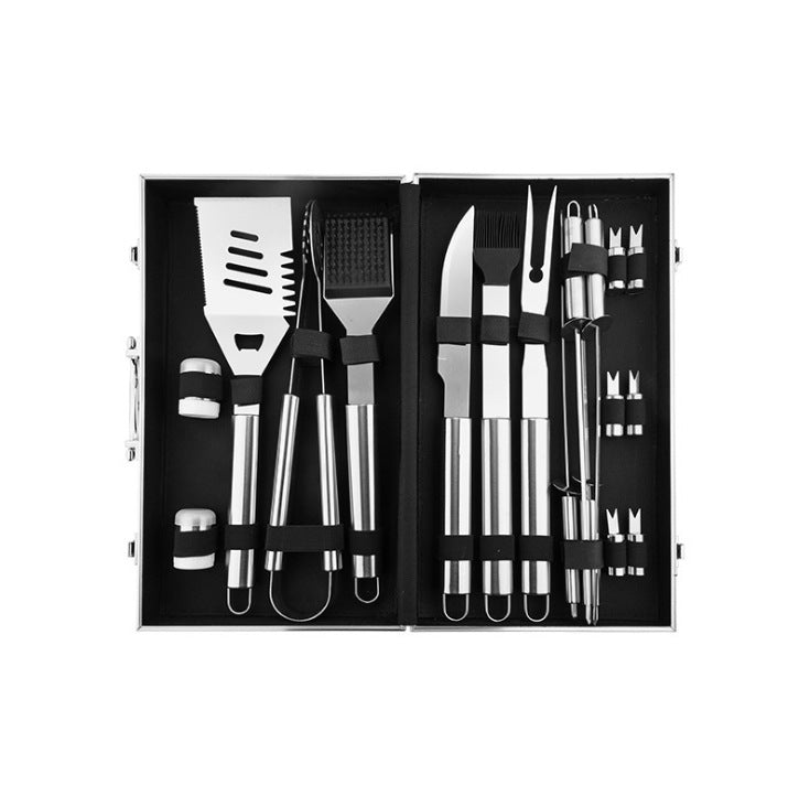 BBQ grill tool set in open aluminum case with stainless spatula, fork, and multiple tools