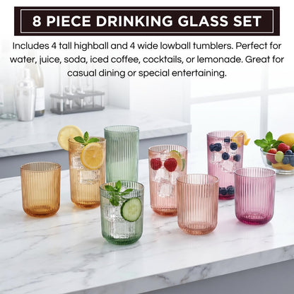 8-piece ribbed drinking glass set on counter with assorted colorful tumblers