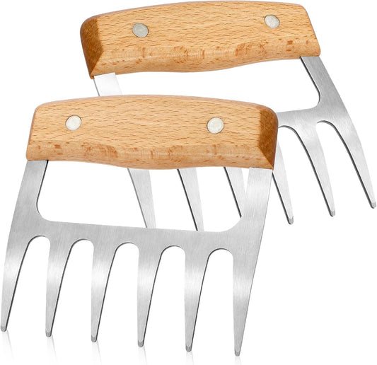 Two stainless steel meat shredder claws with wooden handles and metal tines