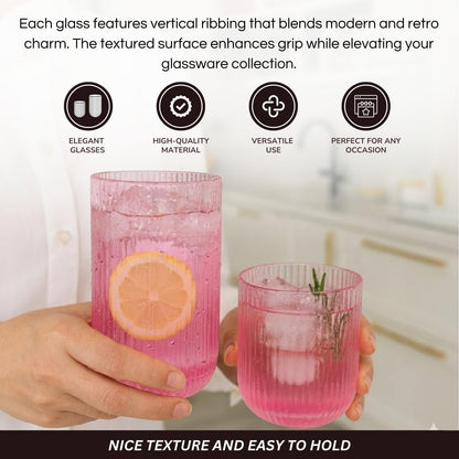 Two ribbed pink drinking glasses with vertical ridges and hand holding