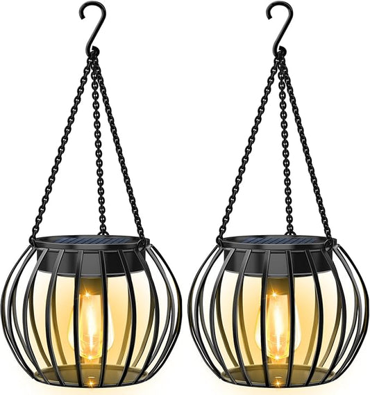 Hanging metal solar lantern with glass bulb inside and black chain, warm glow