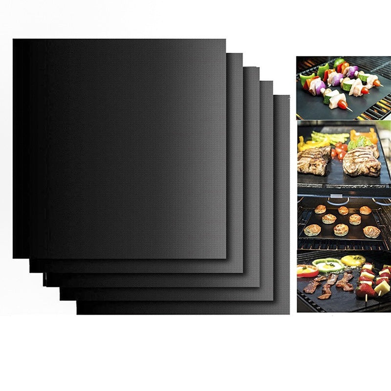 Stacked black non-stick BBQ grill mat sheets with textured surface and layered edges
