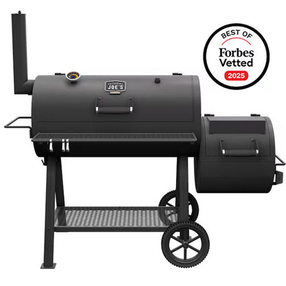 Black offset barrel smoker with side firebox, front grilling grate, and wheeled cart stand