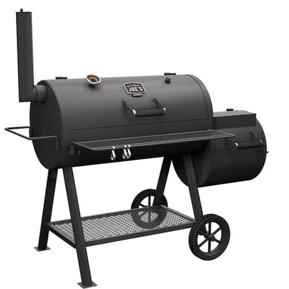 Black offset barrel smoker with side firebox and cooking grates on wheeled stand frame