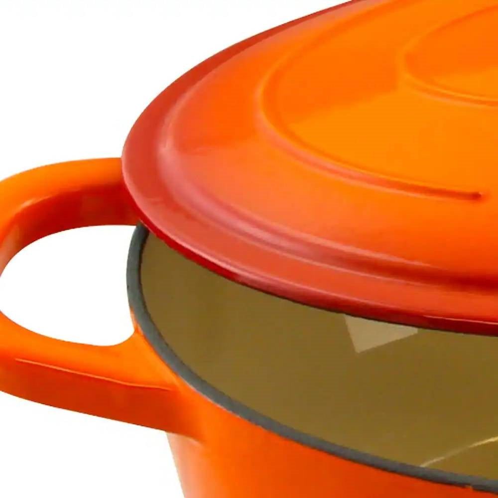 Close-up of orange enameled Dutch oven lid with enamel rim and loop handle