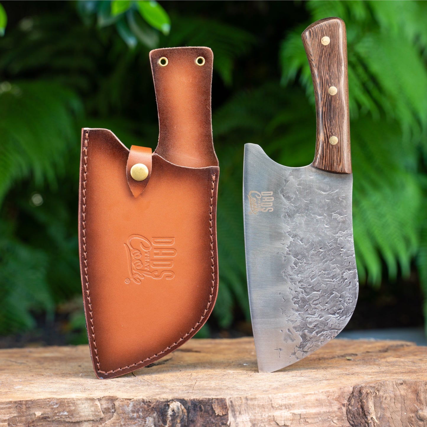 Chef knife with stainless blade and wood handle in brown leather sheath