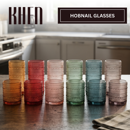 Set of 12 hobnail tumblers, stacked in tonal amber, red, beige, green, and blue