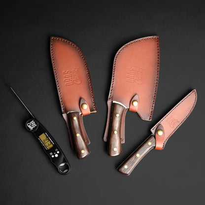 Leather knife sheaths with wood handles for a BBQ knife kit; thermometer tool shown