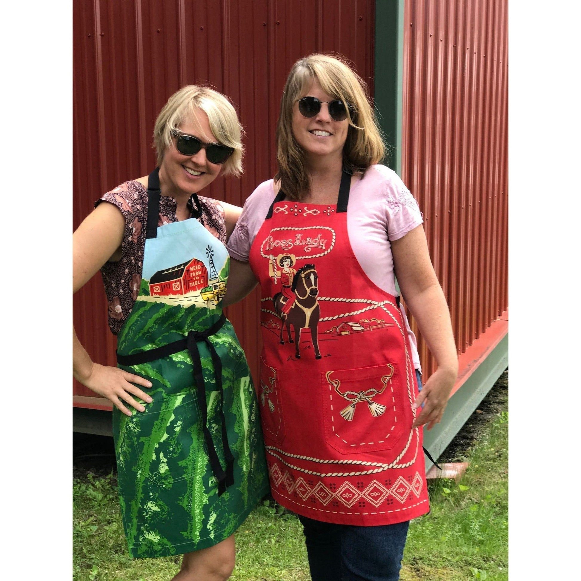 Red cowgirl BBQ apron worn on person, Boss Lady graphic with horse and front pocket