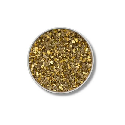 Jar top filled with coarse smoked garlic salt crystals