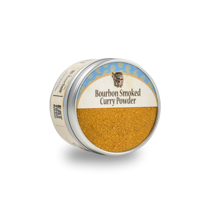Bourbon smoked curry powder jar, gold-brown powder filling the open lid