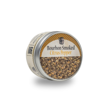 Smoked citrus pepper jar with metal lid, showing coarse pepper seasoning inside