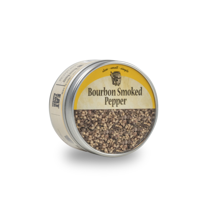 Smoked pepper seasoning tin with metal lid and coarse pepper mix visible