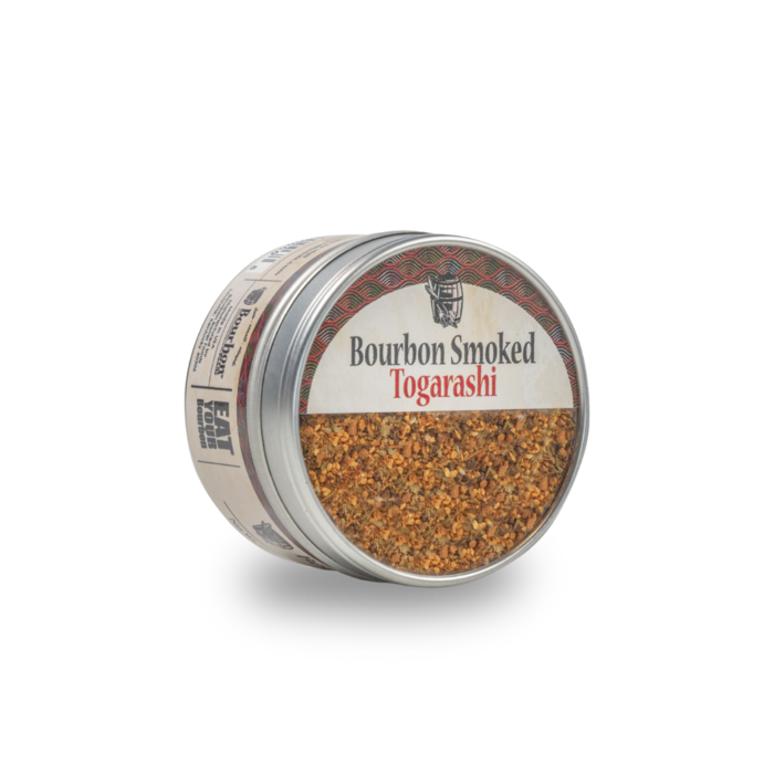 Bourbon smoked togarashi seasoning in open metal container with spice flakes
