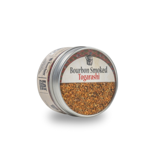 Bourbon smoked togarashi seasoning in open metal container with spice flakes
