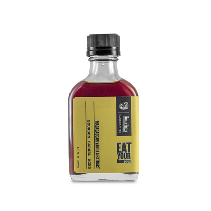 Vanilla extract bottle with dark cap, amber-burgundy liquid, and front label