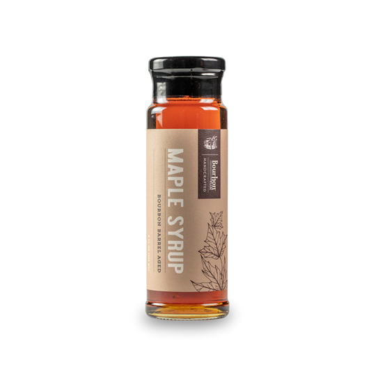 Bourbon barrel-aged maple syrup bottle with amber liquid and front label