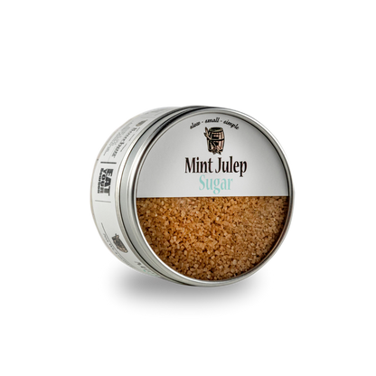Open metal sugar tin with granules and printed lid label