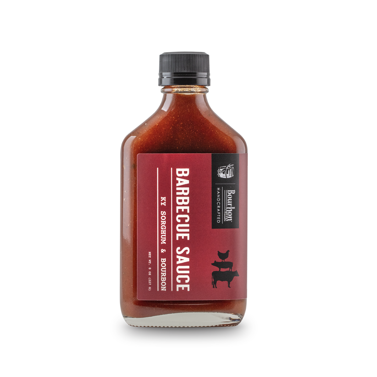 Barbecue sauce bottle with bourbon and sorghum label, dark red sauce